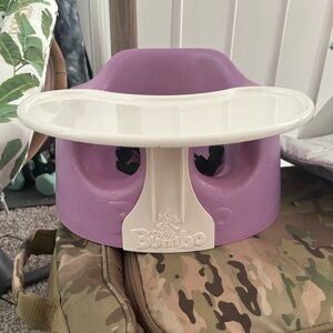 Purple Bumbo seat with tray